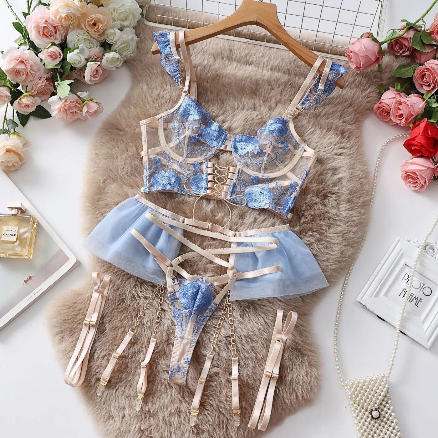 Women's light blue embroidered lace lingerie set with transparent push up bra and matching panty
