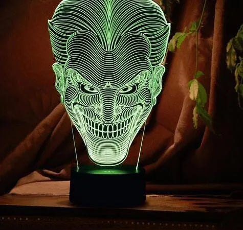 3D acrylic LED lamp on a base showing multi-colour gradient lighting, with a USB cable and remote control.