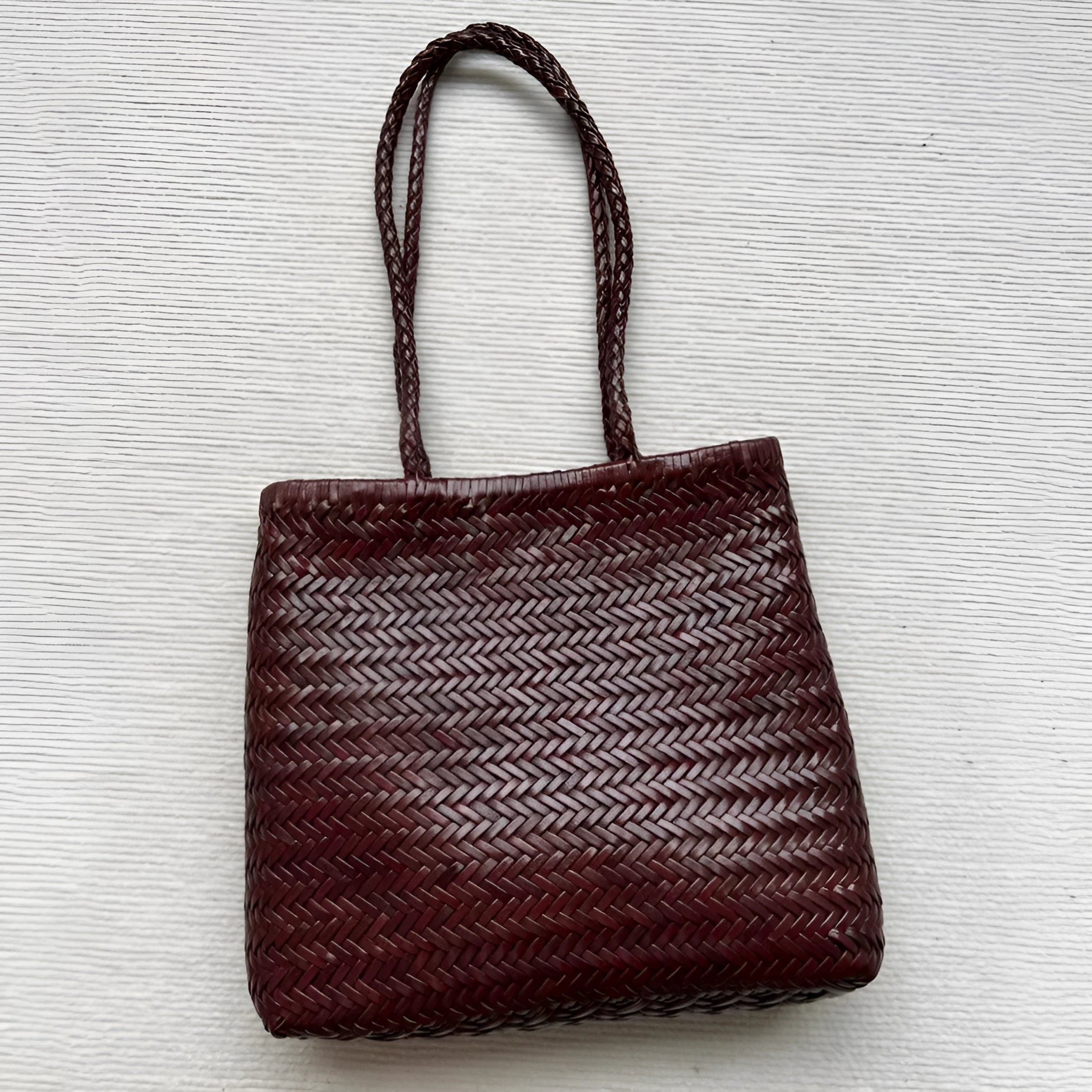 Brown handmade woven tote bag with vintage style and three-dimensional pocket design