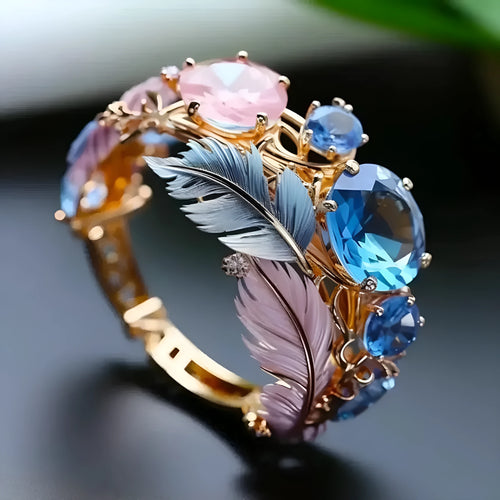 Brass feather ring with embossed geometric design and zircon inlay in gold colour
