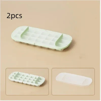 A high capacity plastic ice cube tray with an ice shovel stored in a slot, shown in blue colour.