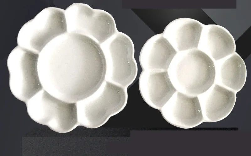 White ceramic plum blossom shaped artist's palette for paint mixing