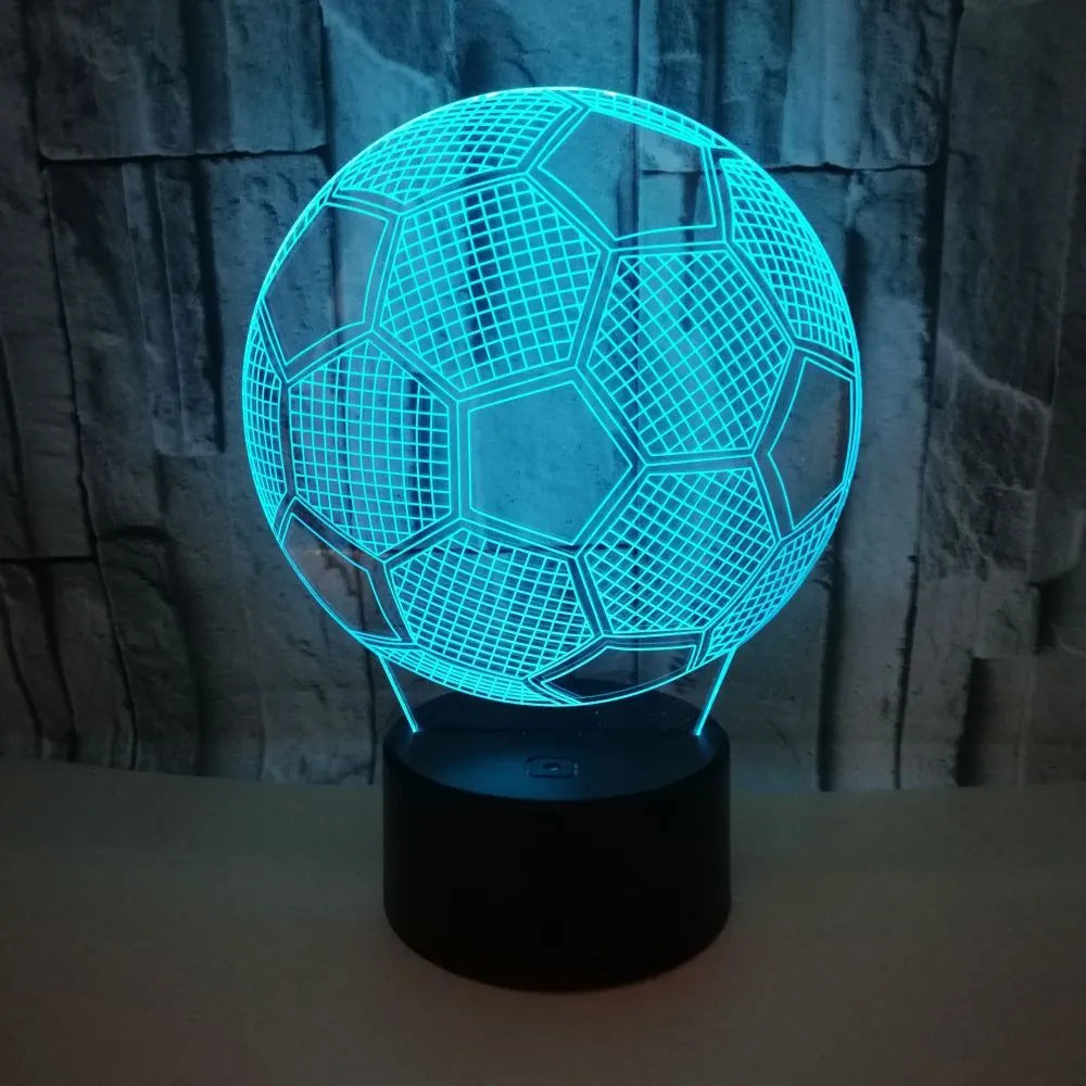 3D acrylic football night light showing red LED colour, with USB cable and remote control.