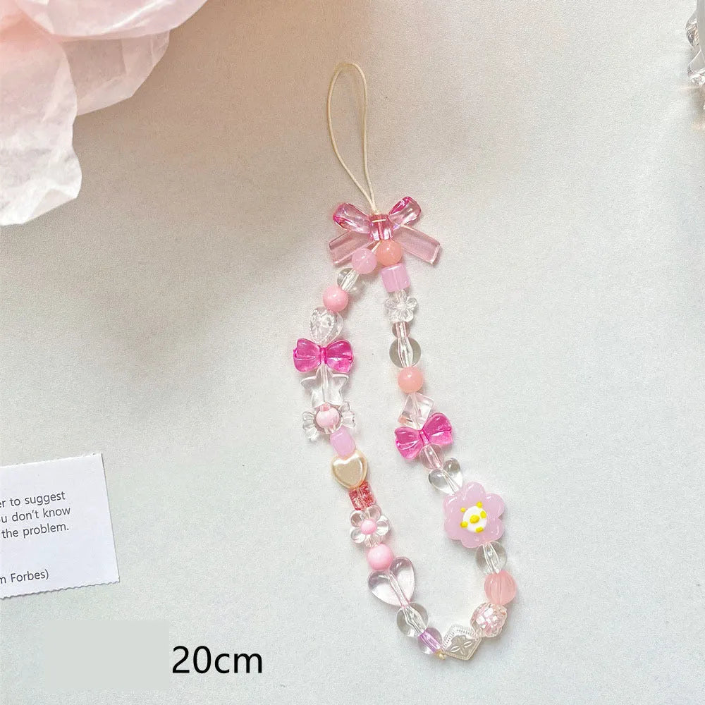 Beaded flower mobile phone lanyard in blue, pink, and yellow colour options