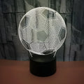 3D acrylic football night light showing red LED colour, with USB cable and remote control.
