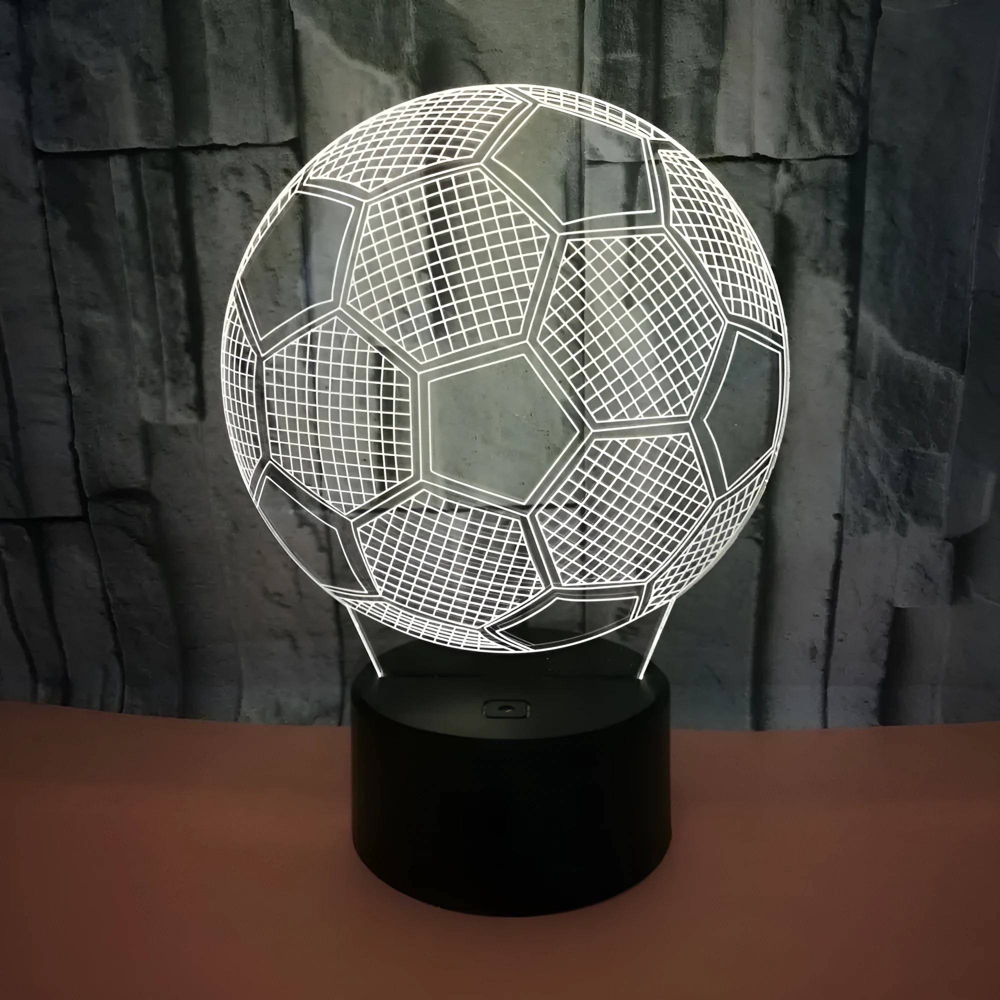 3D acrylic football night light showing red LED colour, with USB cable and remote control.