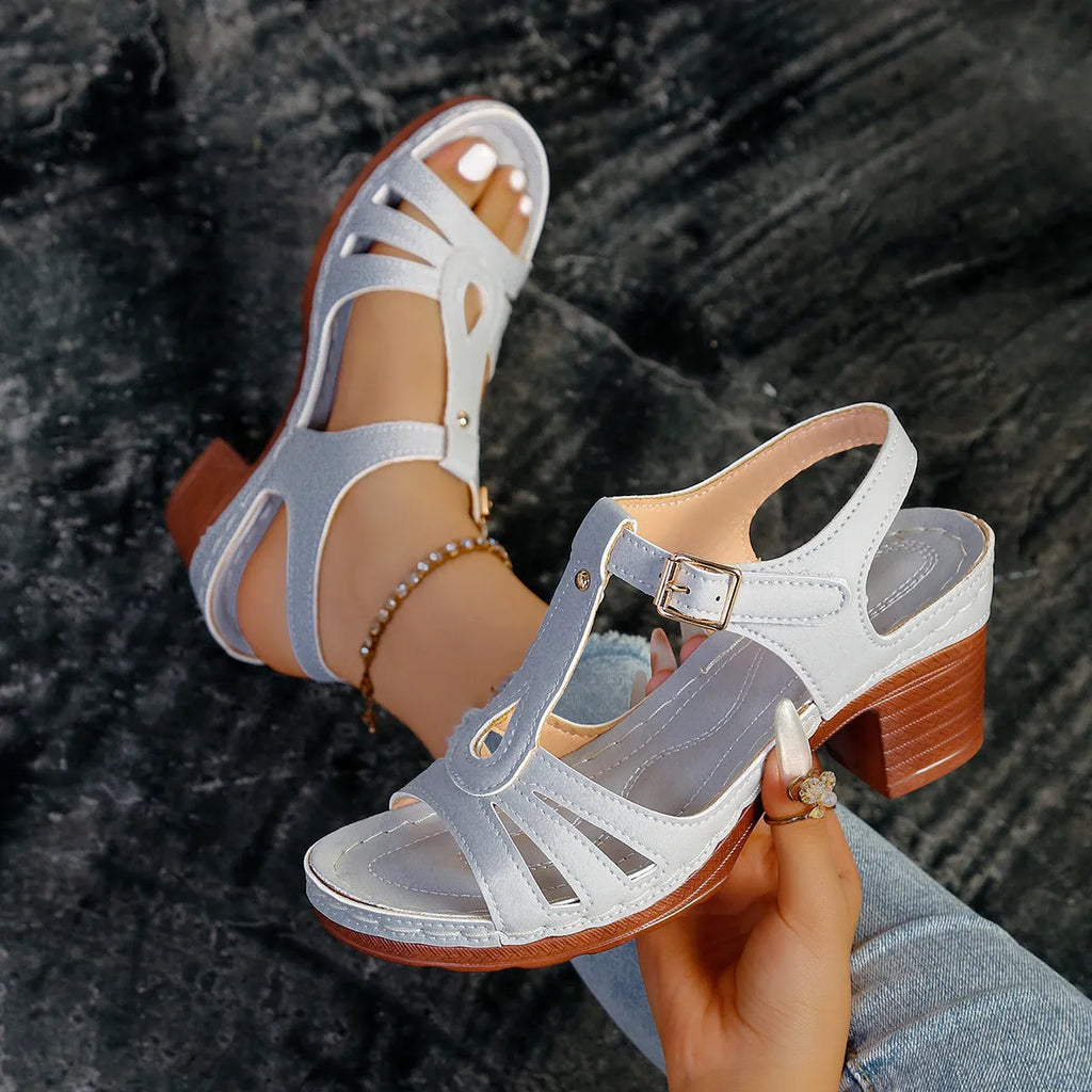 Women's black PU peep toe wedge sandals with a buckle strap on a light background