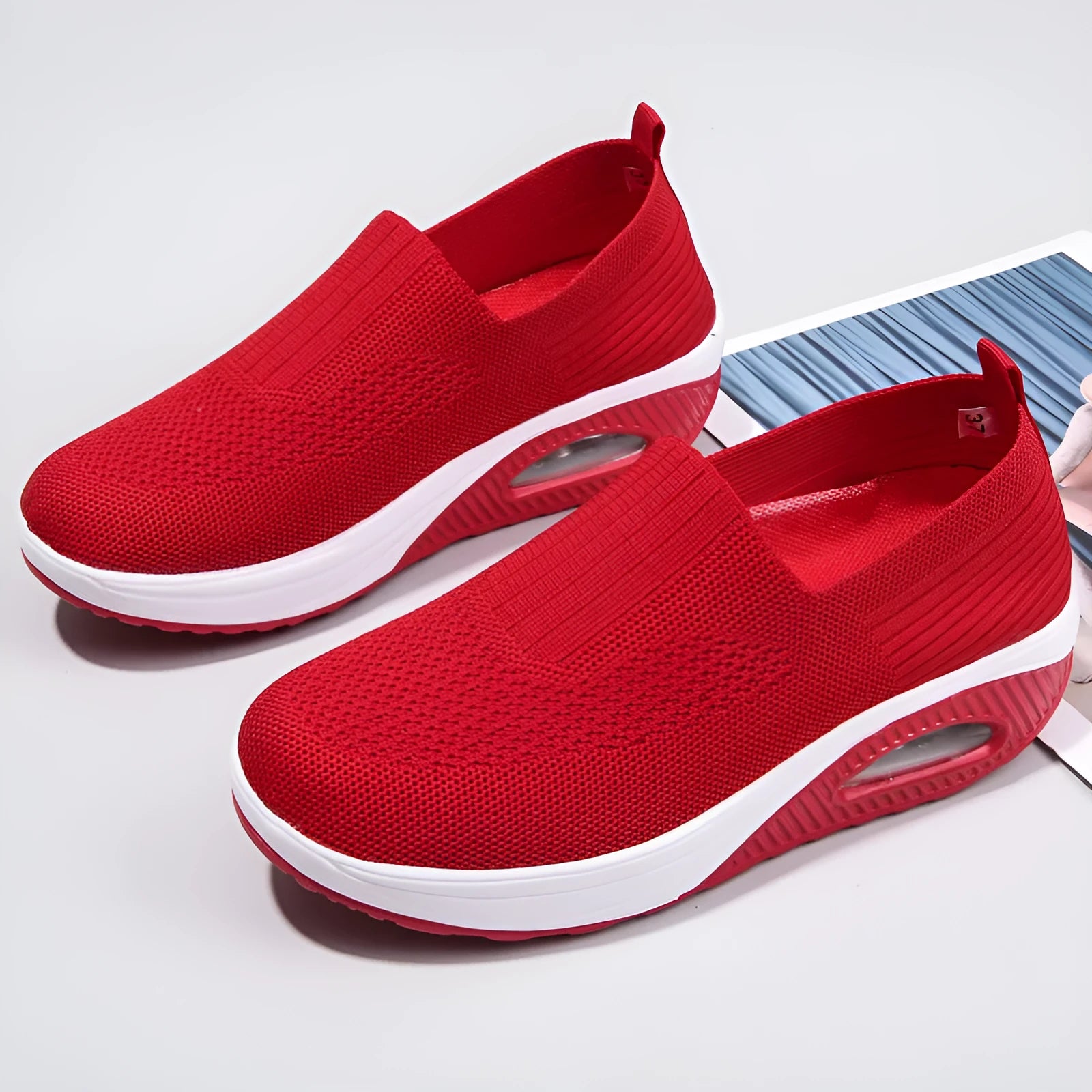 Women's casual running shoes with mesh and PU upper in light gray, showing round toe and mid heel.
