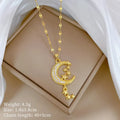 Moon-themed necklace with geometric copper pendant featuring tassel and diamond details on stainless steel chain