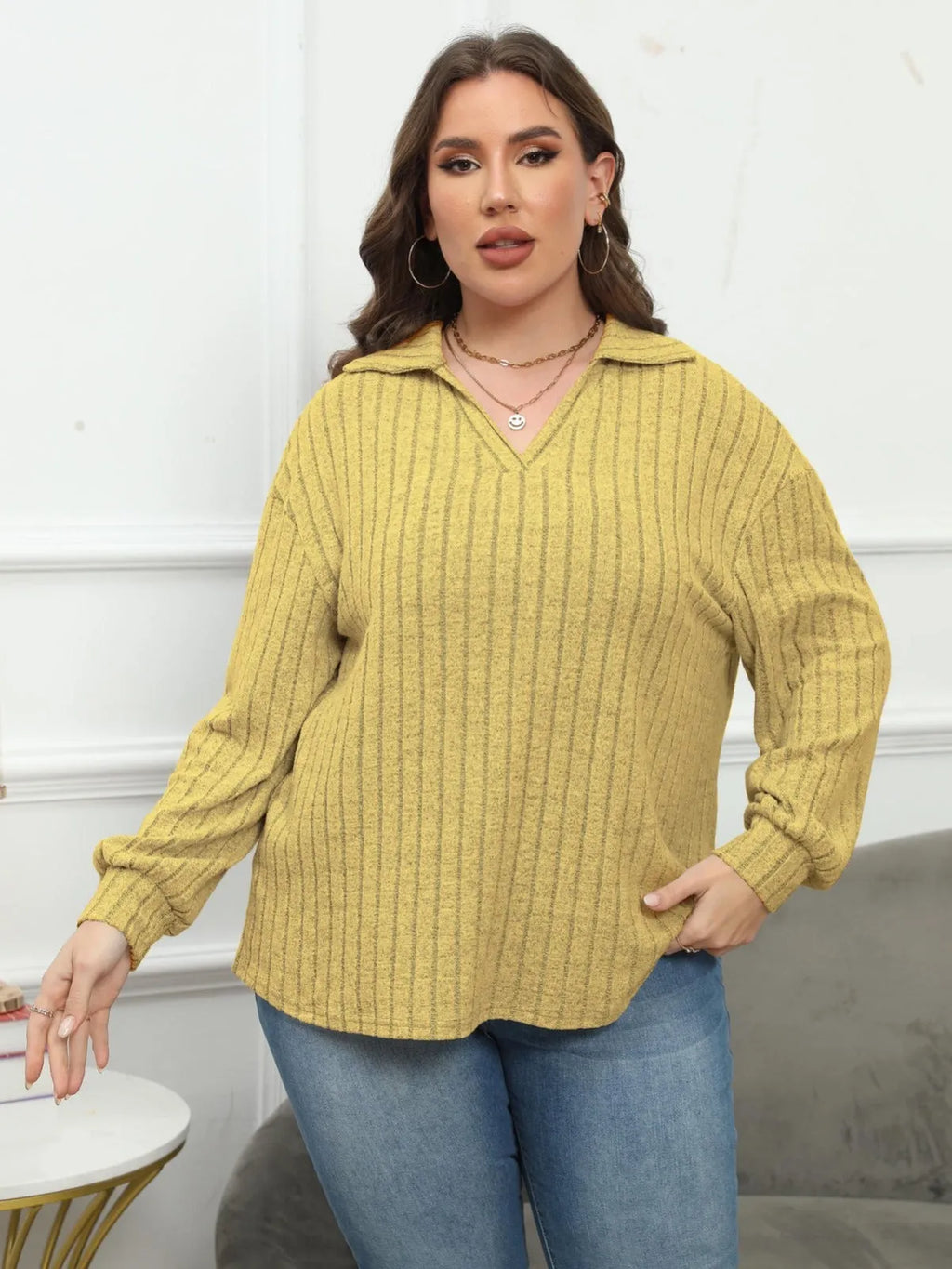 Women's plus size gray polo collar fleece shirt with lantern sleeves on a hanger