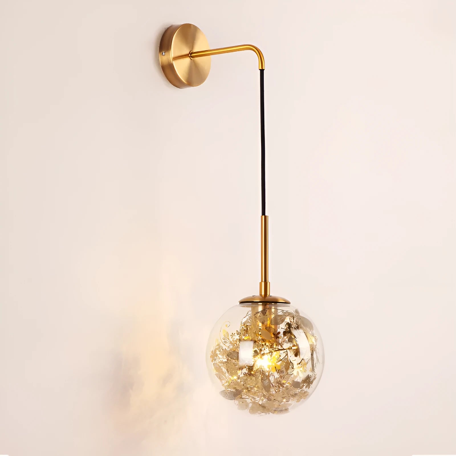 Modern glass wall lamp in golden flower or silver flower finish, shown in 15cm and 20cm sizes