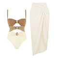 Women's one-piece swimsuit with skirt and gold button detail in solid colour