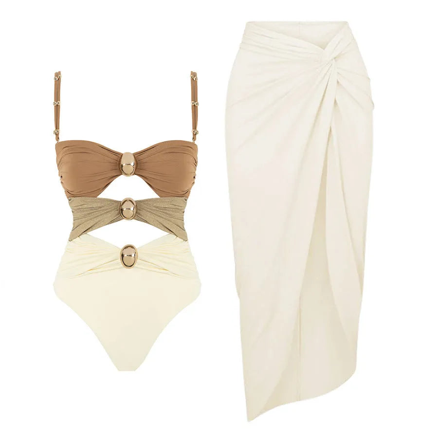Women's one-piece swimsuit with skirt and gold button detail in solid colour