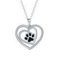 Women's copper necklace with dog's paw footprints and heart-shaped pendant on cross chain