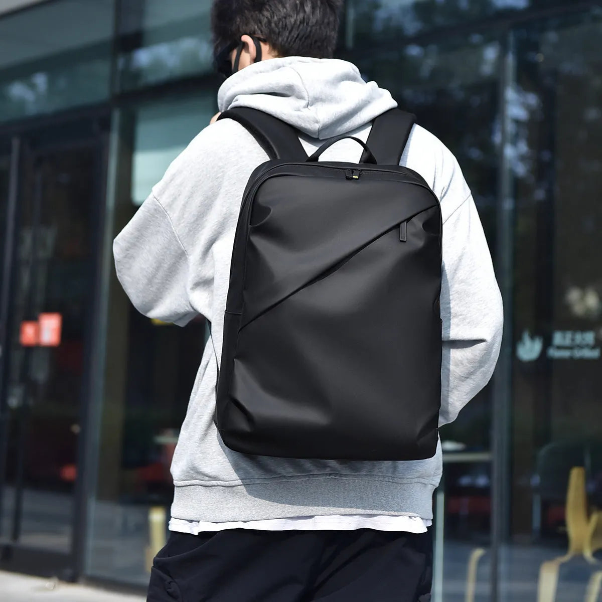 Men's waterproof backpack in black colour made from PU leather with large capacity design