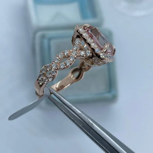 Rose gold electroplated alloy ring with geometrical design shown on hand