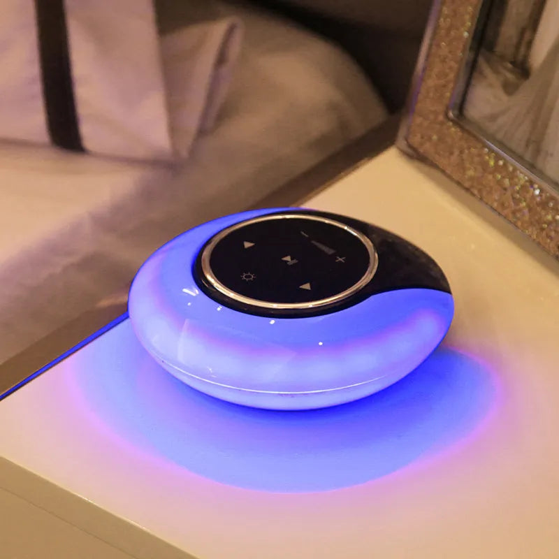 DEAMAK-1 Bluetooth speaker with integrated LED desk lamp showing folding design and touch controls