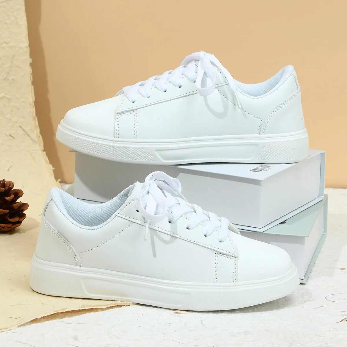 Low-top platform skate shoes with cross-strap detail and mid-heel design in beige brown colour
