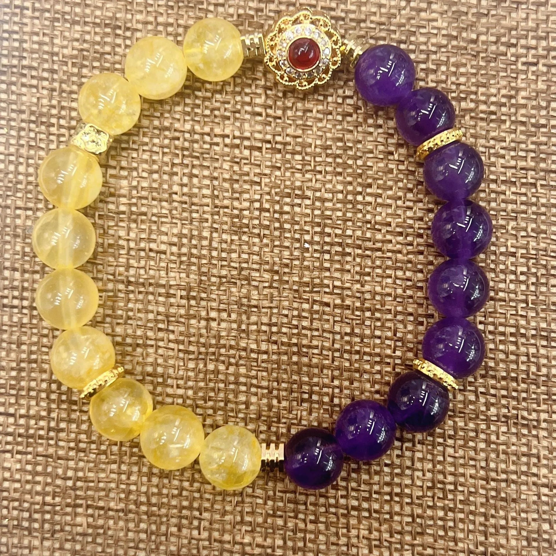 Handmade women's crystal bracelet with yellow and purple amethyst stones