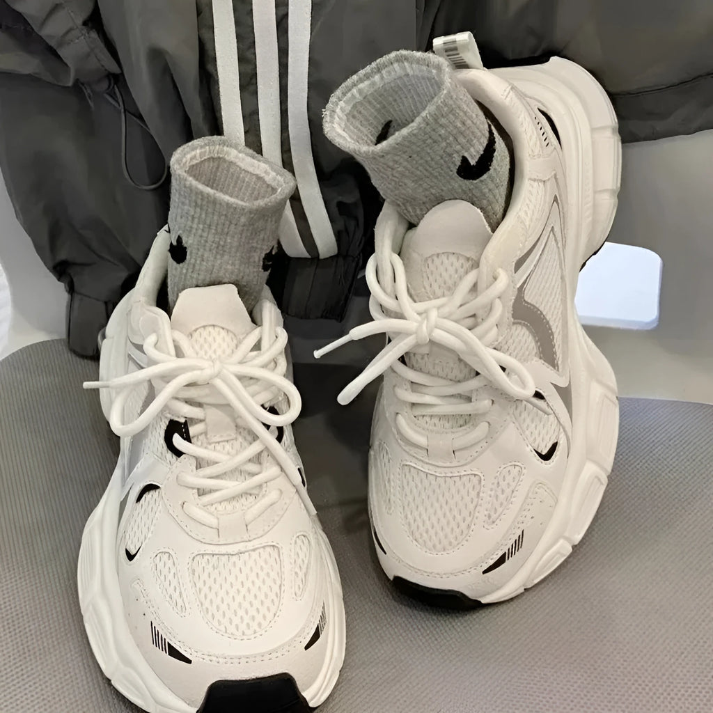 Beige mesh platform sports shoes with wedge muffin heel and lace-up front.