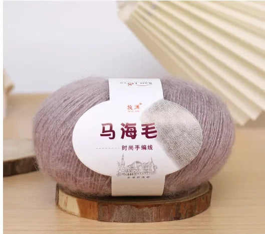 Single ball of mohair yarn in various colours for hand-woven DIY scarf knitting projects