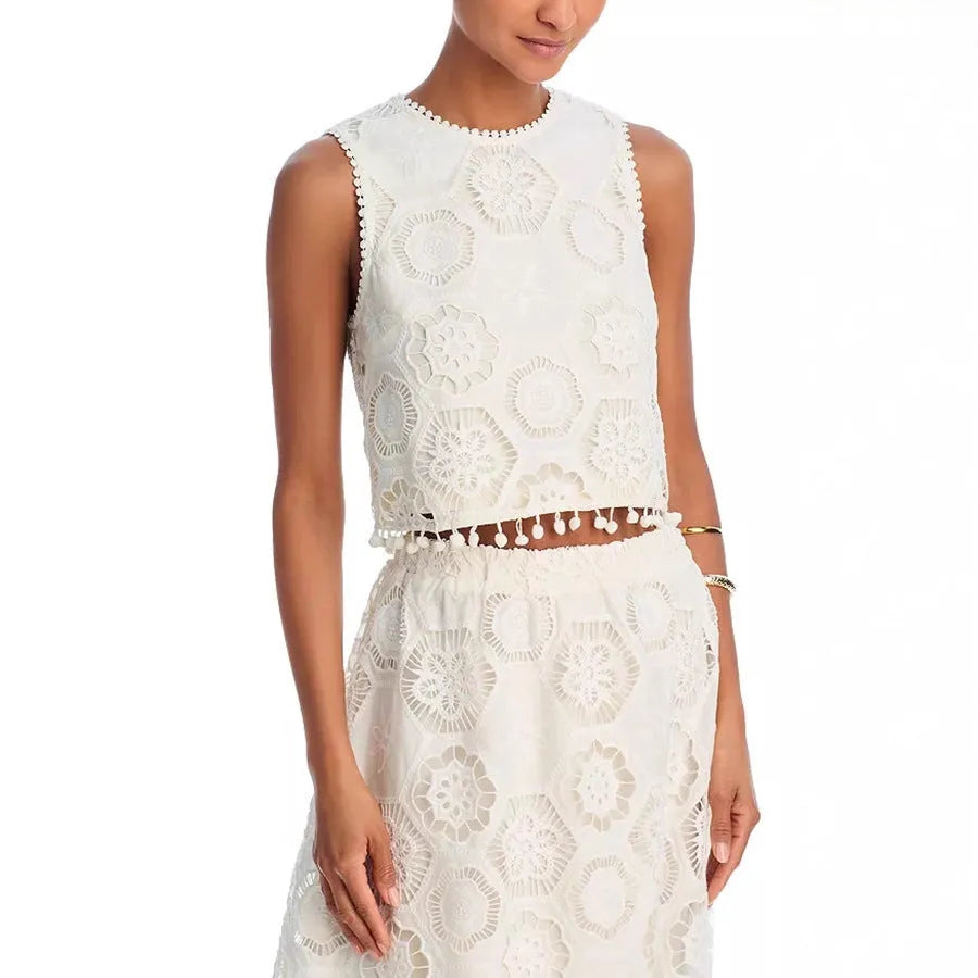 Women's white two-piece suit set with sleeveless top, long skirt, and retro embroidery detail