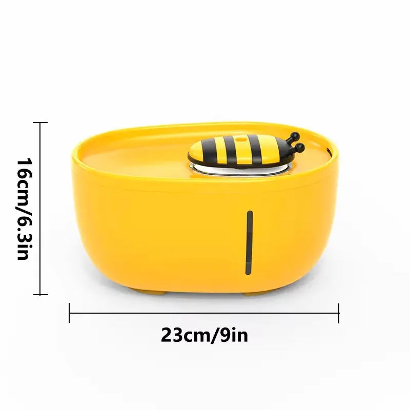 Yellow cat water fountain with filtration system, blue LED light, and water level window.