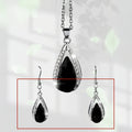 Black and red alloy necklace and earrings set with teardrop glass pendants