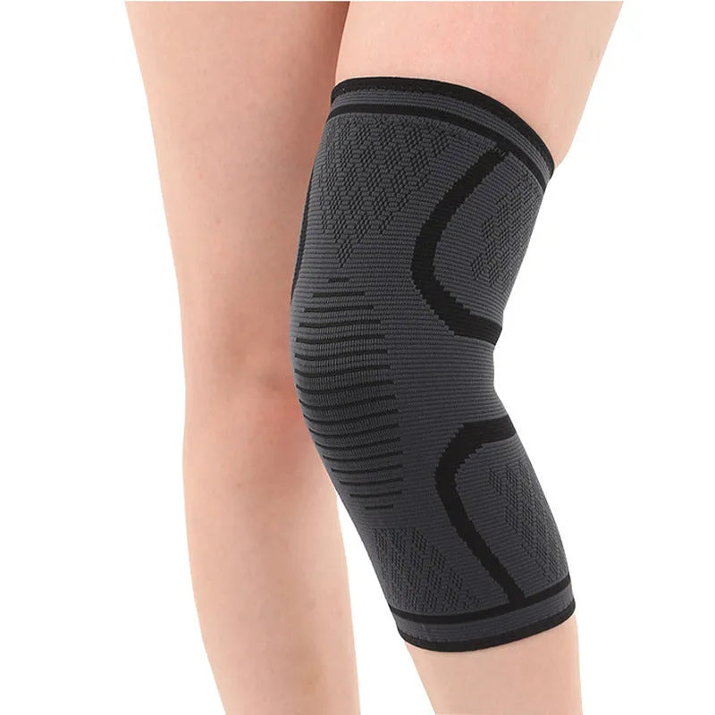 Stretch polyester sports kneepad with corrugated texture in black, shown on a knee.