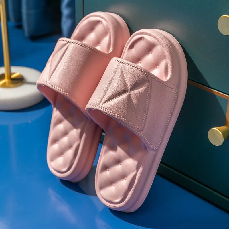 Soft EVA non-slip bathroom slippers with thick sole in assorted colours on a bathroom floor.