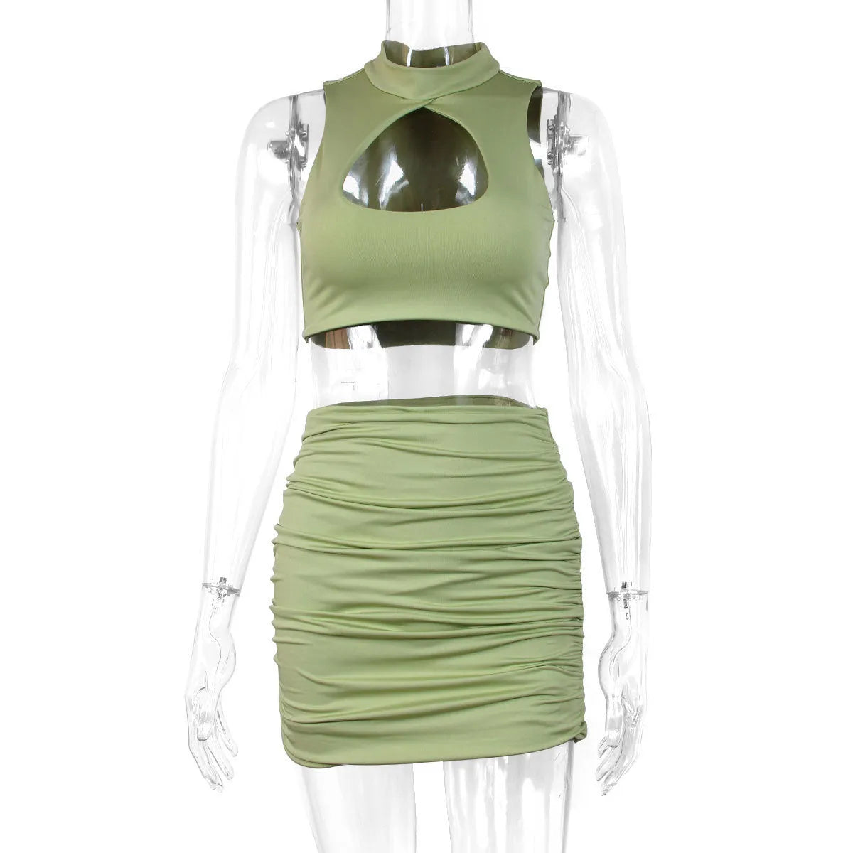 Light purple women's two-piece set with hollow vest and split skirt on a model.