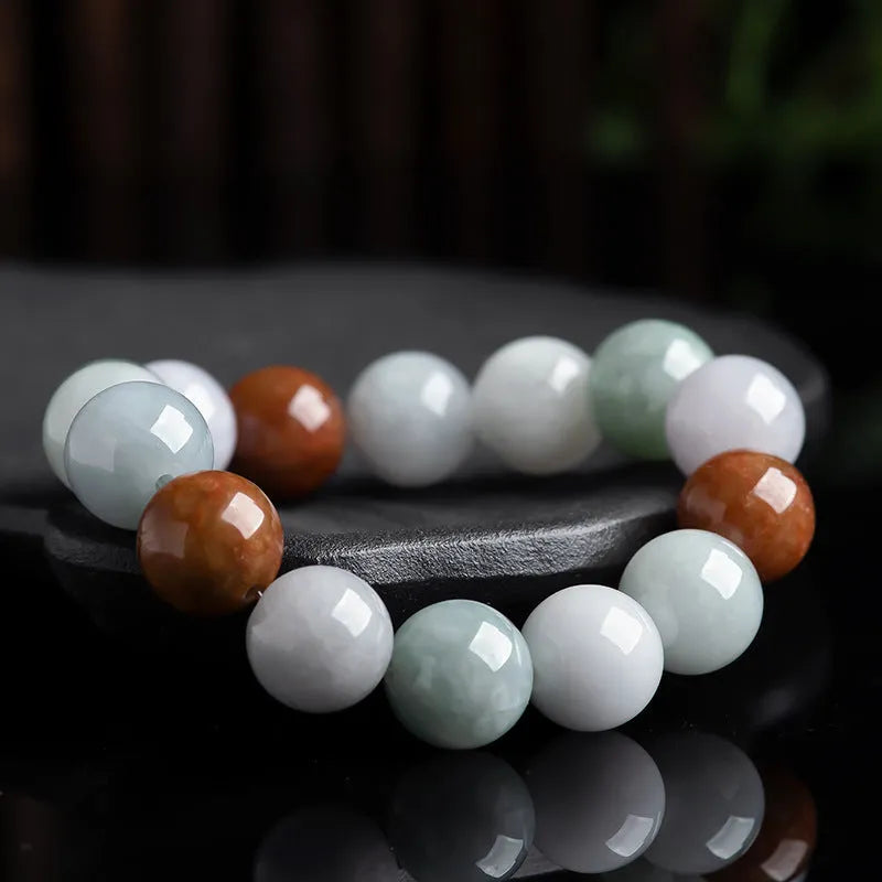 Women's Myanmar jade bracelet showing three-colour pattern on 13mm round beads.