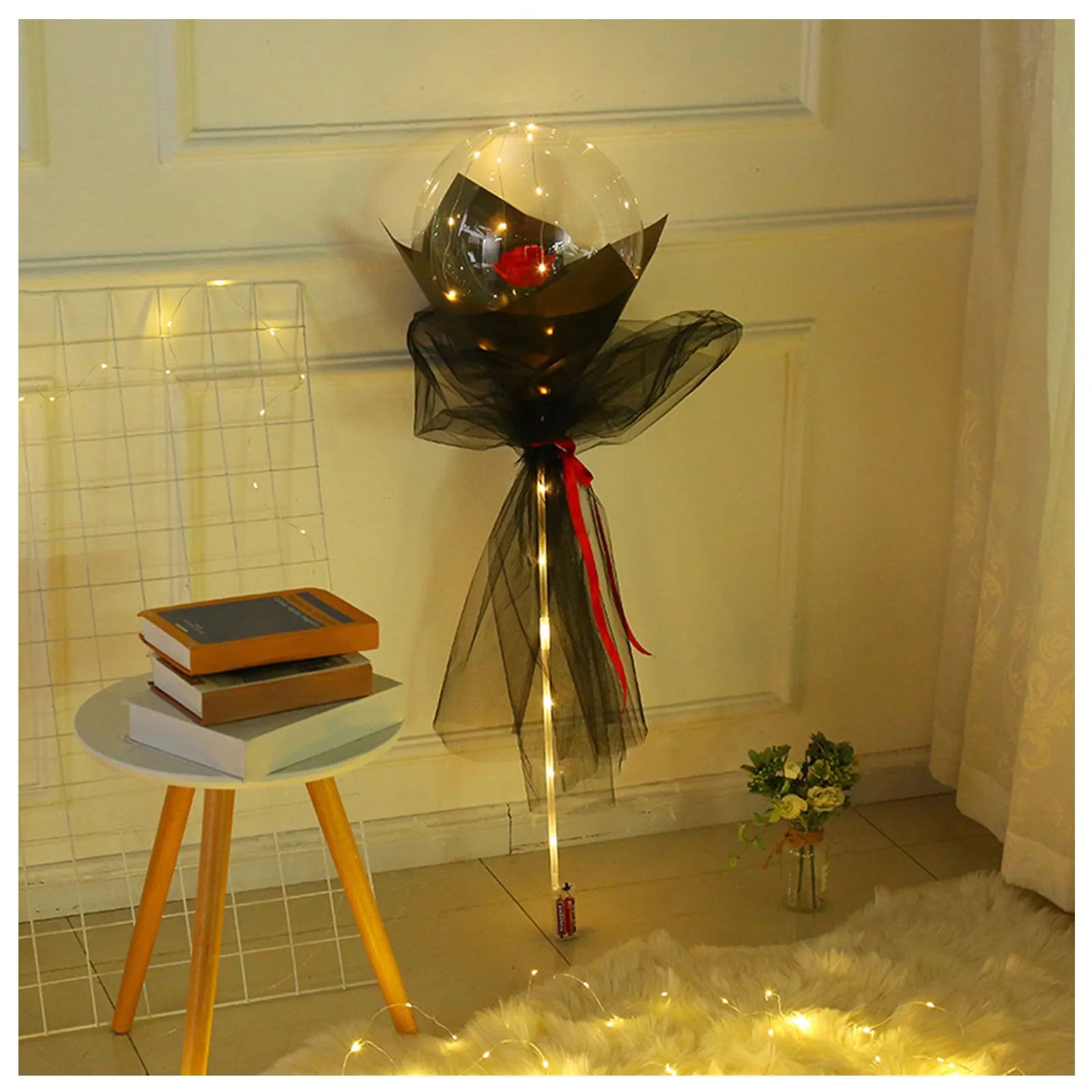 Transparent LED luminous balloon bouquet with artificial rose and glowing light inside, displayed as a DIY kit.