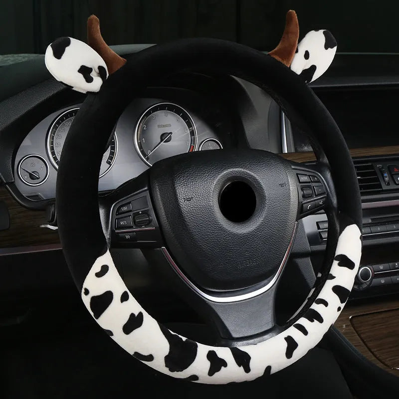Short plush car steering wheel cover in black, showing soft texture and fitted design.