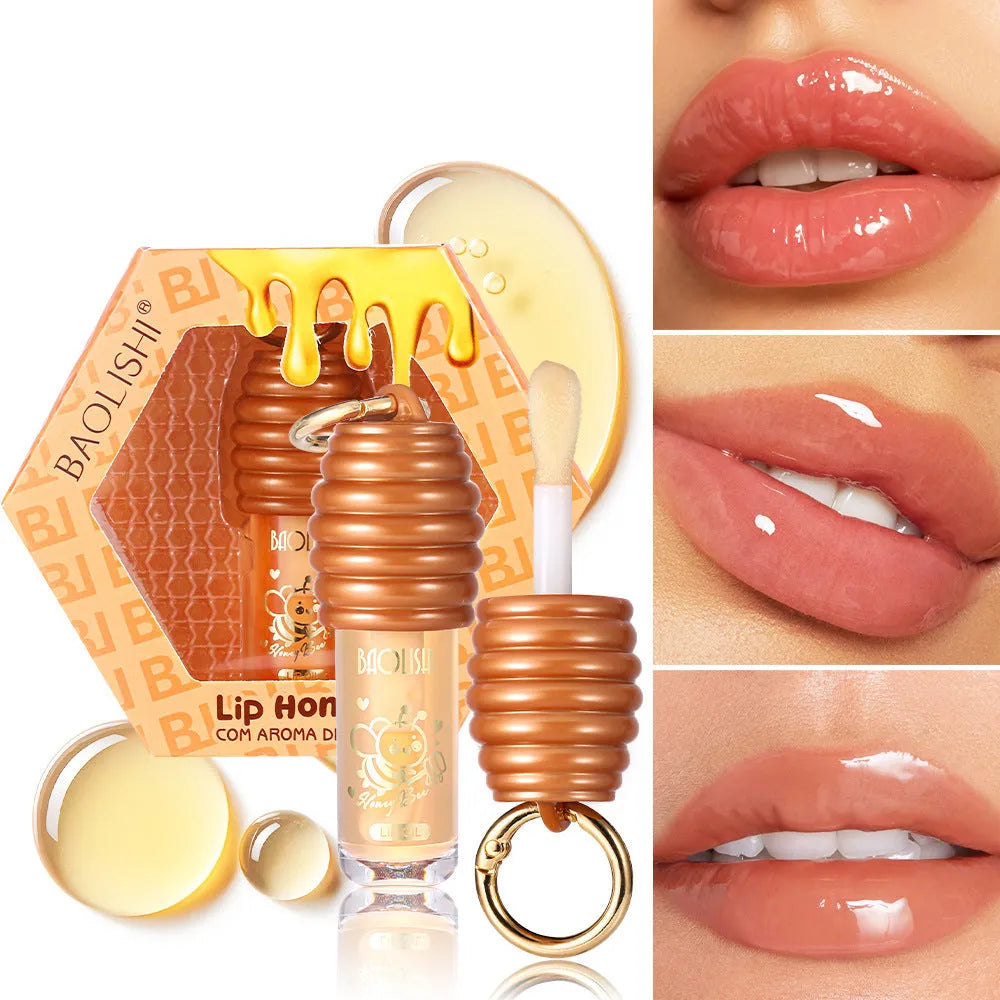 Honey Lip Gloss in a portable keychain case for moisturising and nourishing lips.