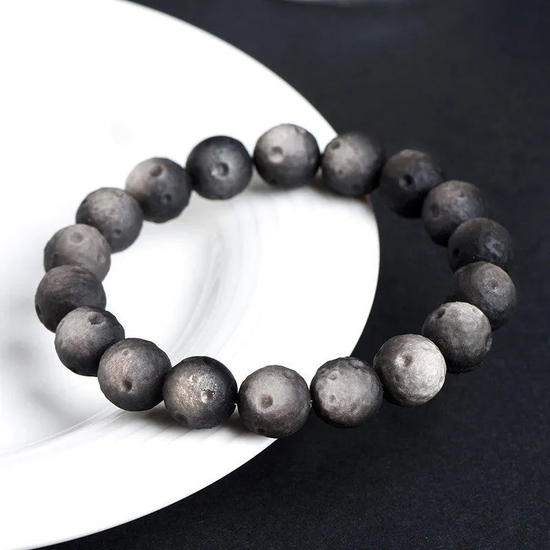 Natural crater ball bracelet featuring gold obsidian and silver stone meteorite beads in various sizes from 9mm to 16mm