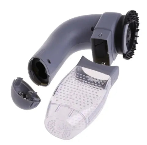 Grey portable pet hair vacuum cleaner with soft rubber head and large collection canister on a fabric sofa.