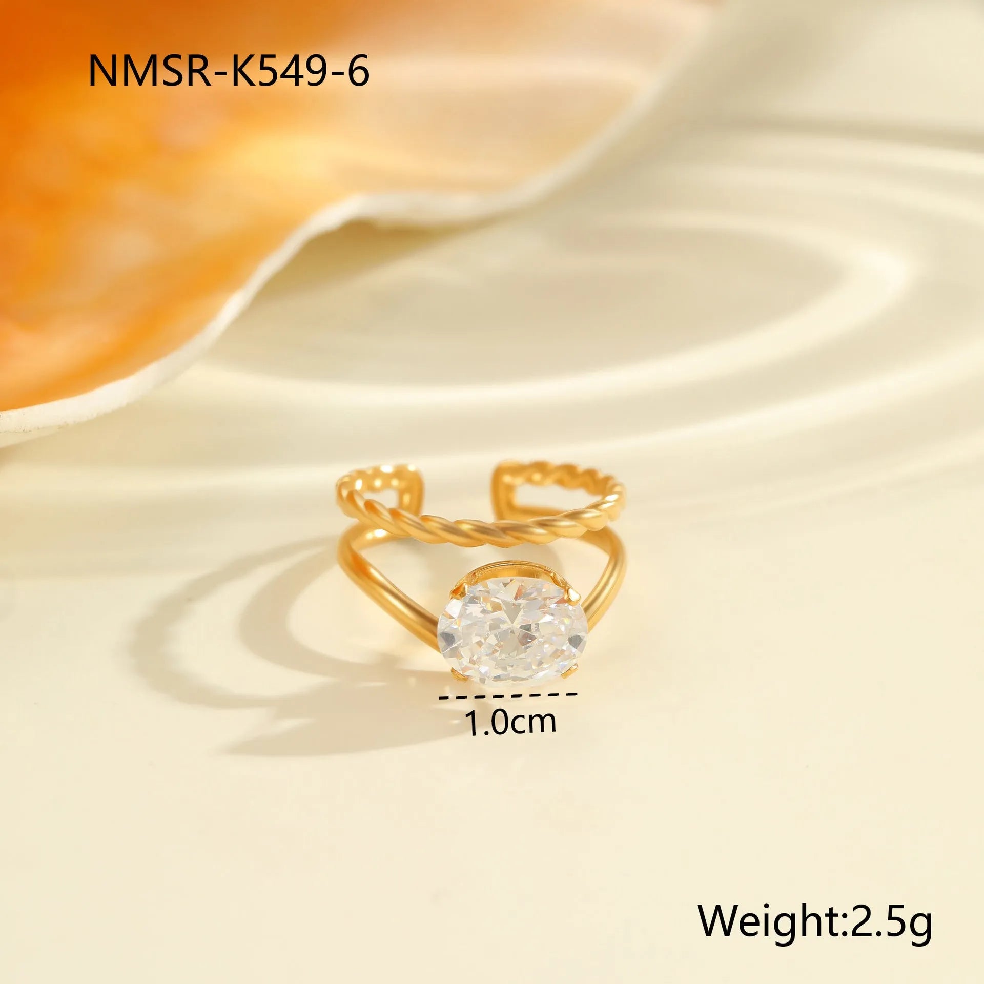 Gold electroplated stainless steel ring with zircon geometric design and open mouth adjustable fit