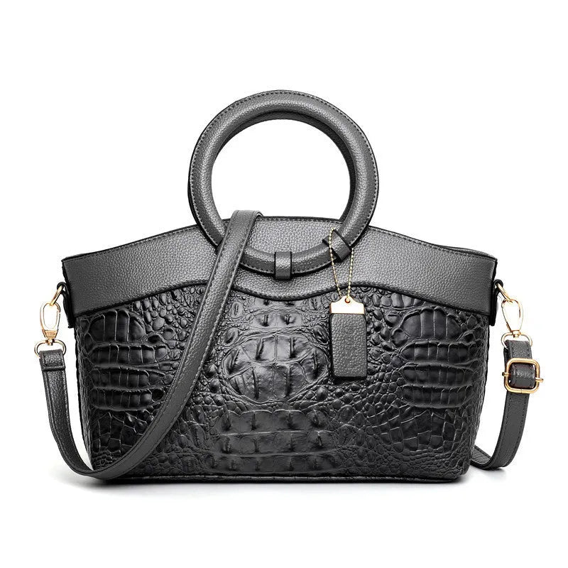 Fabric ladies handbag showing multiple compartments including phone and ID sections