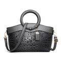 Fabric ladies handbag showing multiple compartments including phone and ID sections