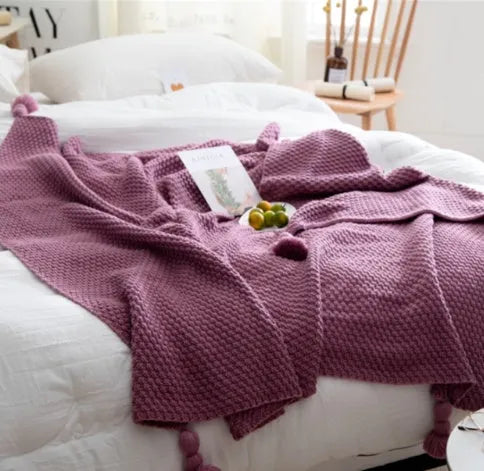 Nordic fringed knit ball acrylic blanket in beige colour, laid flat showing 130x170cm size and fringe detail