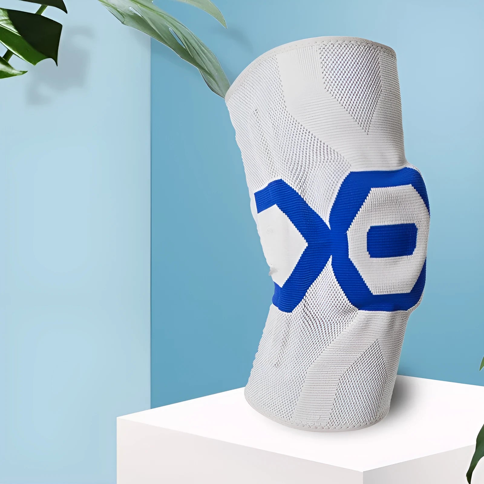 Men's silicone knee pad for sports protection in a two-tone colour, shown on a knee.