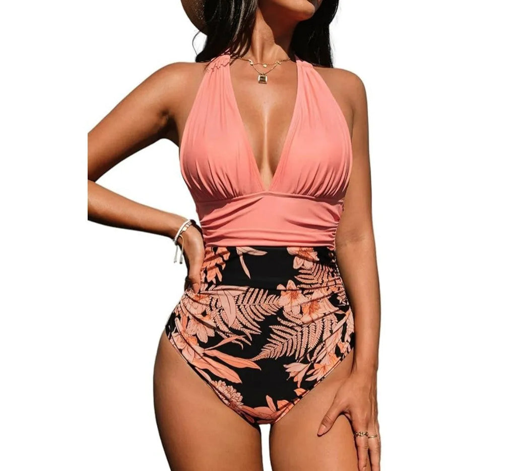 Women's black halter neck one-piece swimsuit on a mannequin, showcasing the backless design