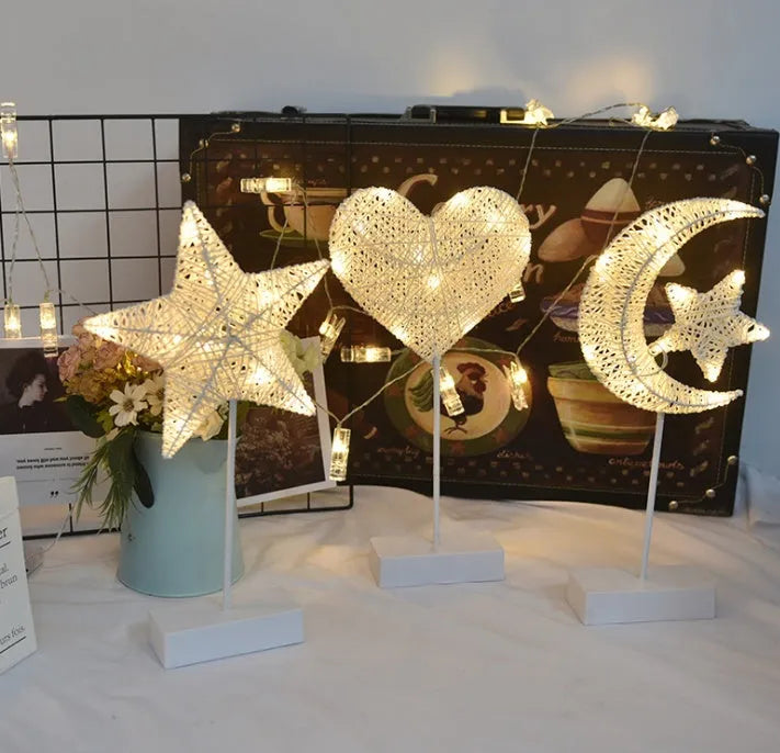 LED string lights with star, heart and moon shapes made from rattan and copper wire for bedroom decoration