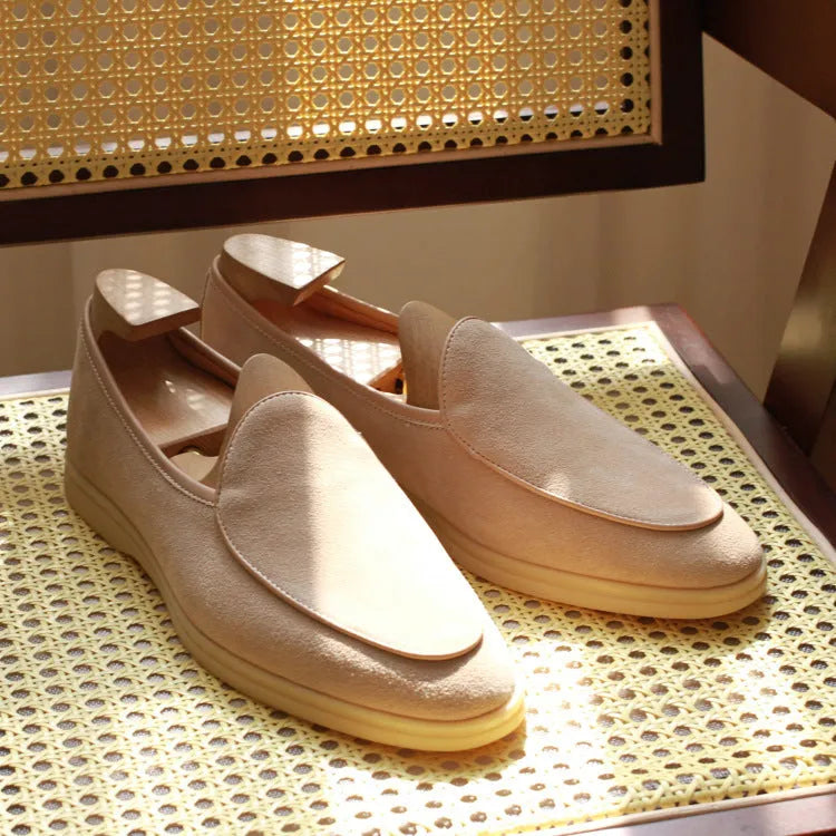 Men's brown genuine leather loafers with a TPR sole on a white background.