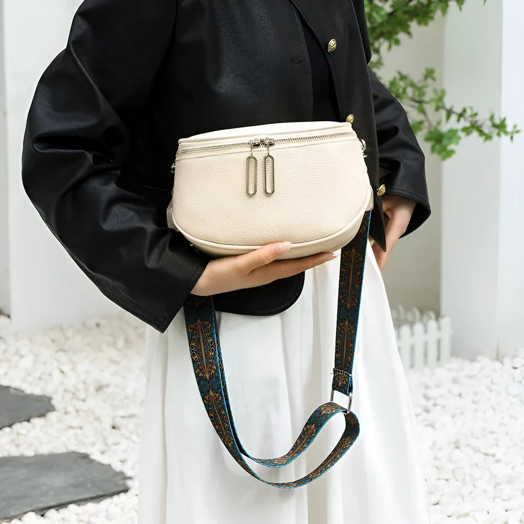 Women's saddle-shaped PU leather messenger bag in green colour with cross-body strap and exterior pocket