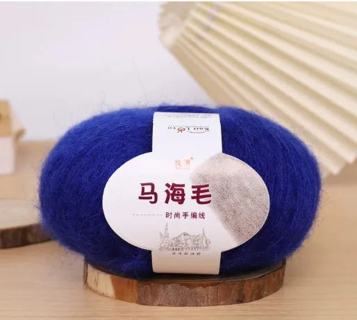 Single ball of mohair yarn in various colours for hand-woven DIY scarf knitting projects