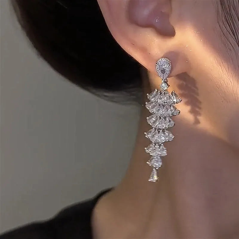 Silver pagoda colour Christmas tree drop earrings with sparkling zircon details on copper studs.