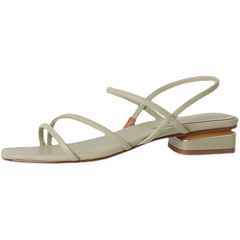 Women's beige flat strap Roman sandals with an open toe and square toe bracket on a white background.