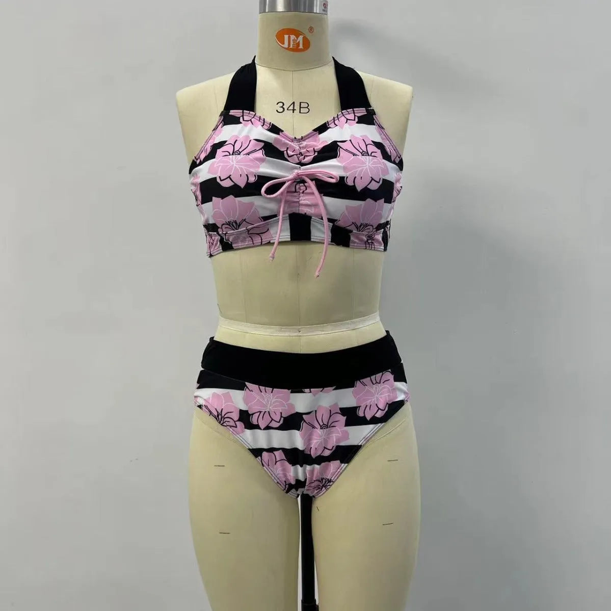 Black women's printed split bikini with high-waisted brief for belly coverage.
